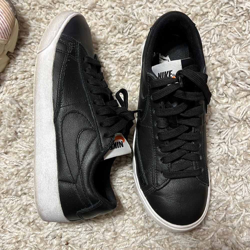 Black leather Nikes